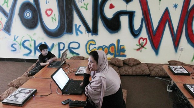 A woman sits in front of her computer at an Internet cafe in Kabul, Afghanistan. (AP File)