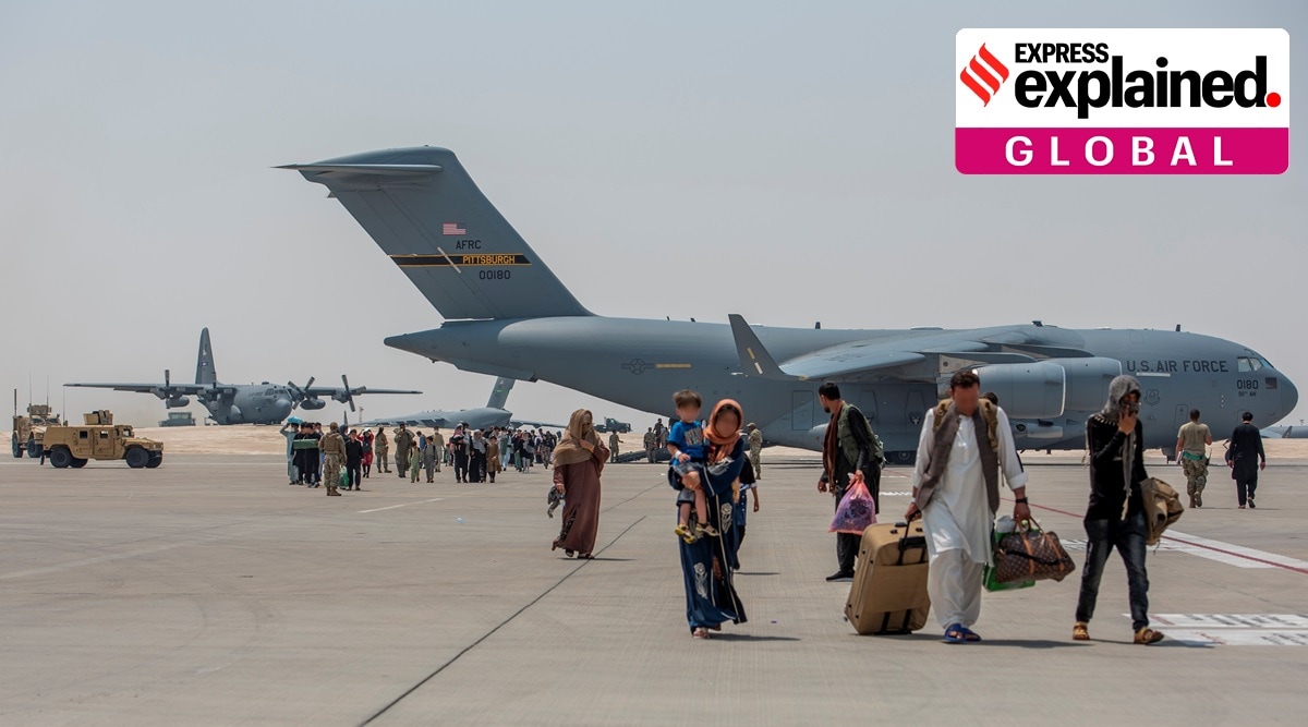 Afghan evacuees debark a C-17 Globemaster lll August 23, 2021, at Al Udeid Air Base, Qatar. (US Air Force/Airman 1st Class Kylie Barrow/Handout via Reuters)