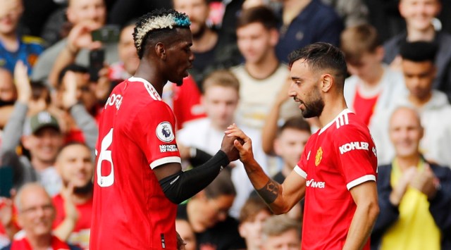 Manchester United's Bruno Fernandes celebrates scoring their first goal with Paul Pogba. (Reuters)
