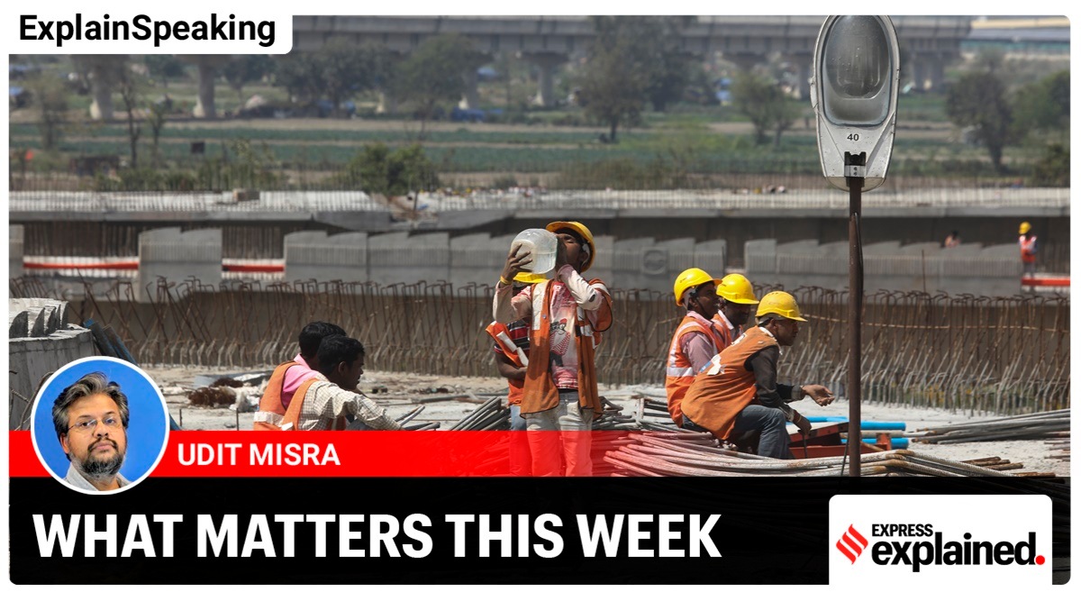 A labourer working at Barapullah Flyover, takes a water break, at the construction site, in New Delhi (Express Photo/Abhinav Saha)