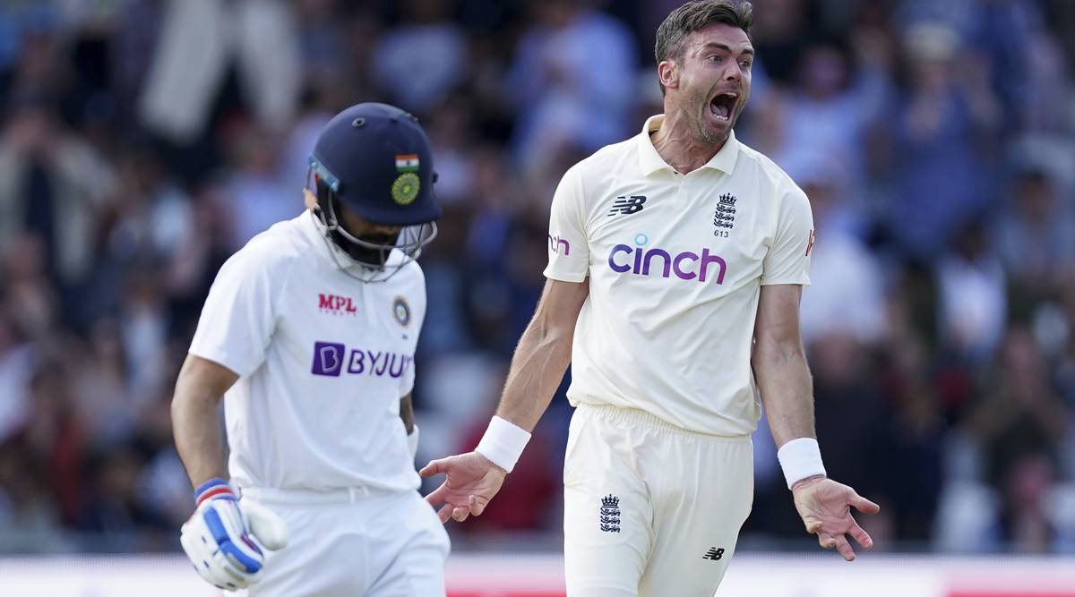 England's James Anderson, right, celebrates the dismissal of India's captain Virat Kohli, left, during the first day of third test cricket match between England and India, at Headingley cricket ground in Leeds, England, Wednesday, Aug. 25, 2021. (AP Photo/Jon Super)