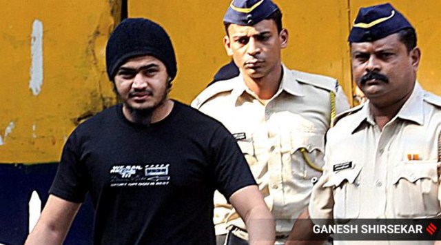 Suspected ISIS member Areeb Majeed being taken court by police security personnel in 2014. (Express File Photo by Ganesh Shirsekar)