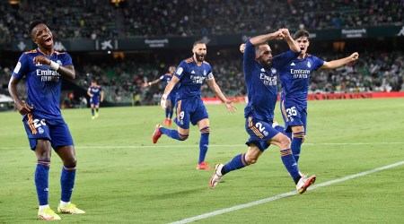 Real Madrid's Dani Carvajal, second right, celebrates with teammates after scoring his side's opening goal during the Spanish La Liga soccer match between Real Betis and Real Madrid at Benito Villamarin stadium in Seville, Spain, Saturday, Aug. 28, 2021. (AP Photo/Jose Breton)