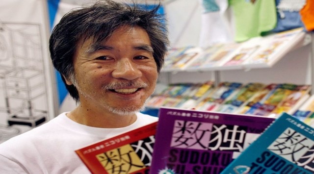 'Father of Sudoku' Maki Kaji holds copies of the latest sudoku puzzles at the Book Expo, in New York, June 3, 2007. REUTERS/Chip East