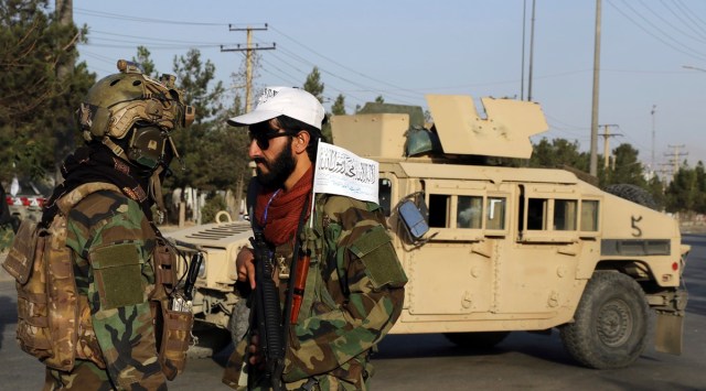 Taliban fighters stand guard at a checkpoint near the gate of Hamid Karzai international Airport in Kabul, Afghanistan on Aug. 28, 2021. (AP)