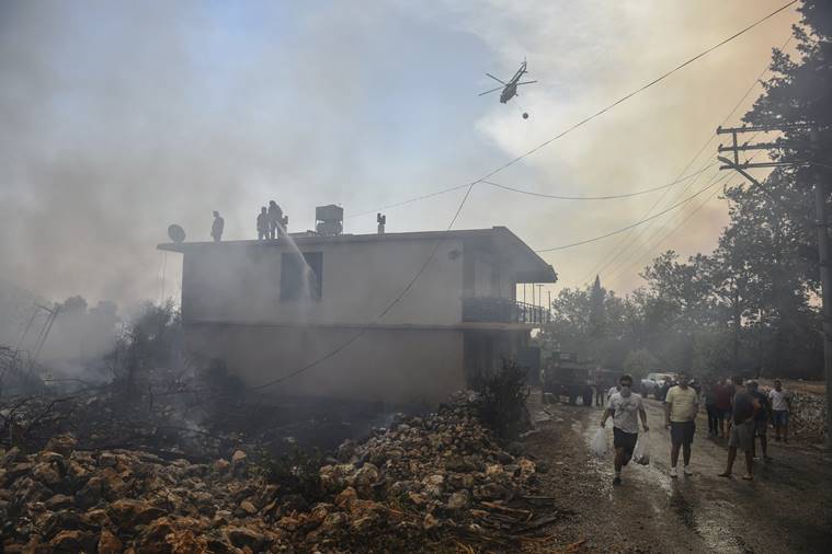 Tourists, villagers flee as wildfires ravage Turkish resorts