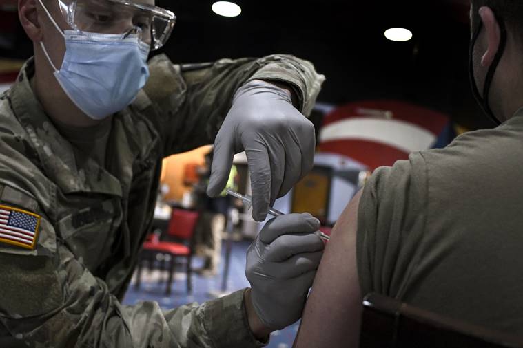 Short of the mandate they crave, military leaders race to vaccinate troops