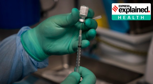 A health worker prepares a syringe with the Covid-19 vaccine in Santa Ana, Calif. (AP Photo/Jae C. Hong)