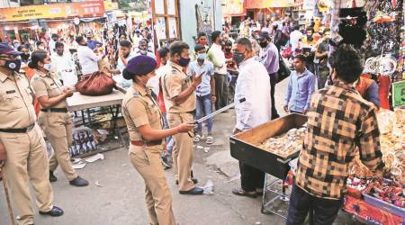 Pune Police carried out an operation to check if Covid-19 norms and restrictions are being followed at Tulshibagh and Mandai on Wednesday evening.  (Express Photo by Ashish Kale)