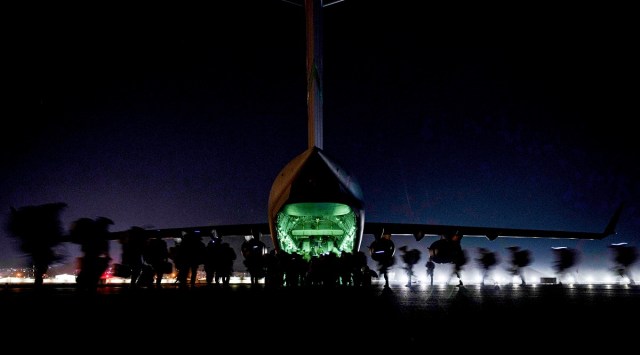 US soldiers, assigned to the 82nd Airborne Division, prepare to board a US Air Force C-17 Globemaster III aircraft to leave Hamid Karzai International Airport in Kabul. (Reuters)