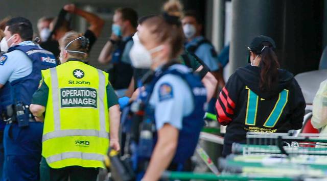 Police and ambulance staff outside the Auckland supermarket after the 'terror attack' on Friday. (Alex Burton/New Zealand Herald via AP)