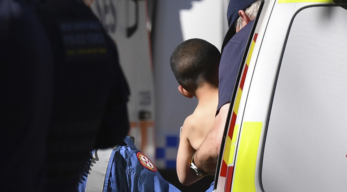 Three-year-old AJ Elfalak is carried by a paramedic into an ambulance after he is found alive on the family property near Putty, north west of Sydney, Australia, Monday, Sept. 6, 2021. (AP)