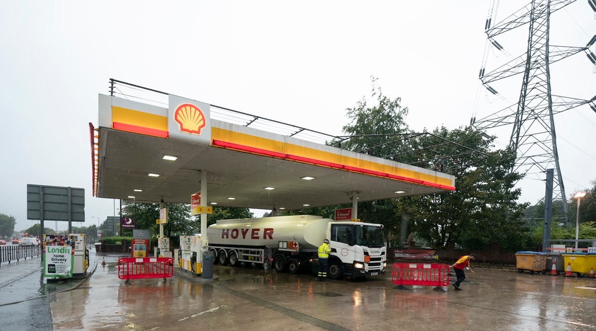 A fuel delivery is made to a petrol station in Manchester which had run out of fuel after an outbreak of panic buying in the UK. (AP)