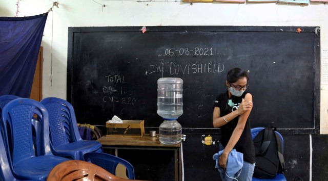 A young woman after receiving the vaccine for Covid-19 at a vaccination center in Bengaluru. (AP)