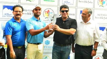 Honey Baisoya receiving  the winners’ trophy from Sarmad Hafeez, secretary, tourism & culture of Jammu & Kashmir with senior J&K officials at the Royal Springs Golf Course in Srinagar on Saturday.