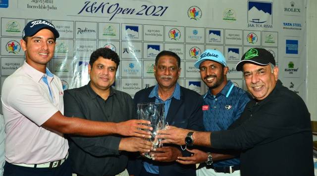 Professional golfer Kshitij Naveed Kaul (from left to right), Sarmad Hafeez, secretary, J&K tourism & culture department, Sampath Chari, tournament  director, golfer Chikkarangappa S and Bakshi Javid Hamayun, director, SKICC Royal Springs Golf Course unveiling the trophy. 