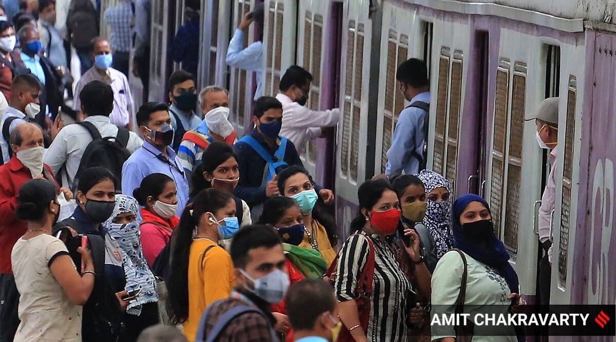 Commuters wait to board a Mumbai local train on August 8, 2021. (Express Photo: Amit Chakravarty)
