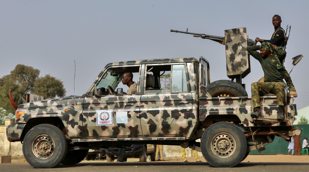 Security forces patrol as people wait for the arrival of the rescued schoolgirls in Jangebe, Zamfara, Nigeria March 3, 2021. (Reuters)
