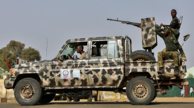 Security forces patrol as people wait for the arrival of the rescued schoolgirls in Jangebe, Zamfara, Nigeria March 3, 2021. (Reuters)