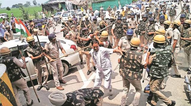 Police lathicharge protesters to break-up the stir at Bastara toll plaza, Karnal. (Express File Photo)