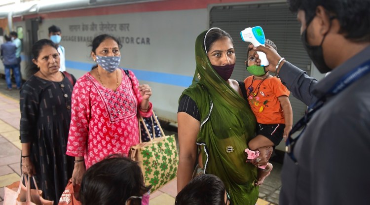 Passengers undergo thermal screening as they wait for the Covid-19 testing after arriving at a railway platform on a long distance train at Dadar railway Station in Mumbai, Wednesday, Sept. 22, 2021. (PTI)