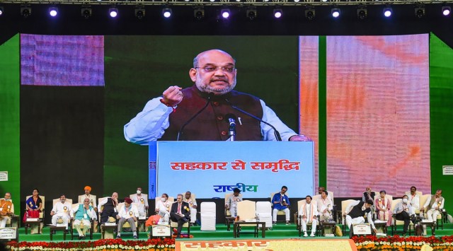 Union Home Minister Amit Shah addresses the 'National Cooperative Conference' at Indira Gandhi Indoor Stadium in New Delhi on Saturday. (PTI Photo)