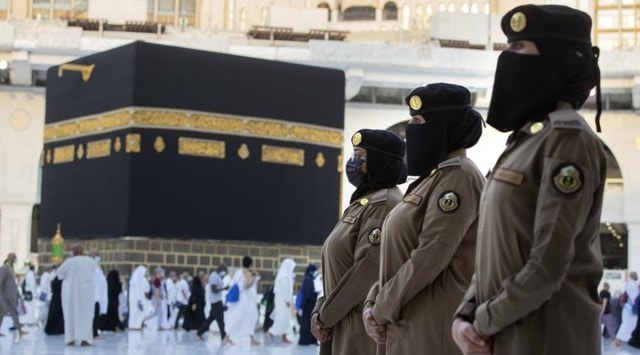 Saudi police women, who were recently deployed to the service, from right to left, Samar, Alaa, and Bashair, stand alert in front of the Kaaba, the cubic building at the Grand Mosque, during the annual hajj pilgrimage in the Saudi Arabia's holy city of Mecca. (AP)