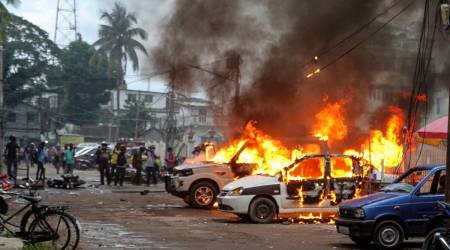 Vehicles in flames after clashes between BJP supporters and CPM activists in Agartala. (PTI)