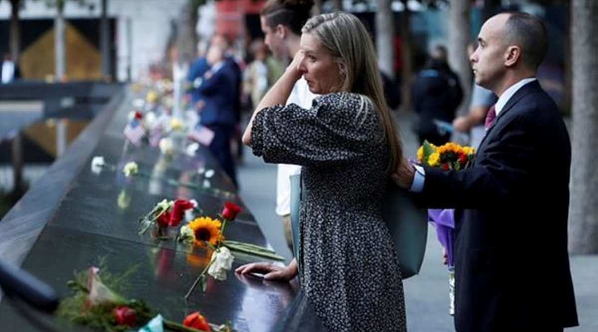 People mourn at the 9/11 Memorial on the 20th anniversary of the September 11 attacks in Manhattan, New York City, U.S., September 11, 2021. (Reuters)