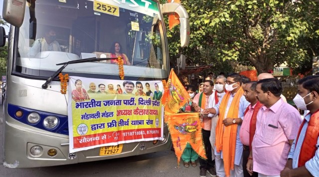 BJP general secretary organisation Siddharthan flagging off a bus to Mathura — Vrindavan in Mandawali on Sunday.