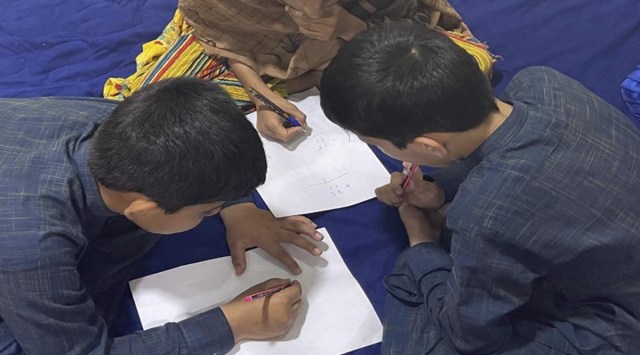 This September 2021 photo provided by their mother shows three children in Afghanistan. Every night, their father, a U.S. green card holder from California, and his wife take turns sleeping, with one always awake to watch over their three young children so they can flee if they hear the footsteps of the Taliban. (AP Photo)