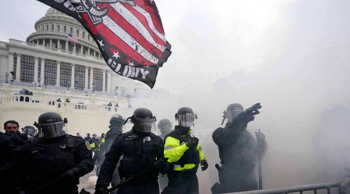 Police hold off Trump supporters who tried to break through a police barrier, Wednesday, Jan. 6, 2021, at the Capitol in Washington. (AP Photo/Julio Cortez)