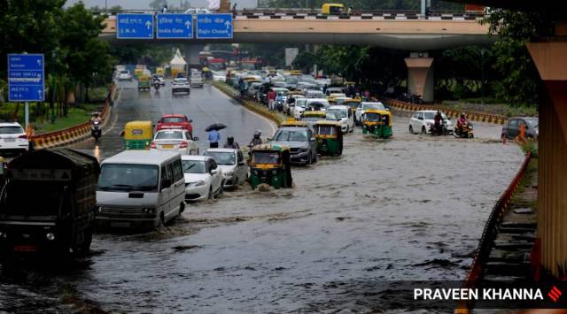 Heavy rain caused waterlogging and traffic jam in New Delhi on Saturday. (Express Photo: Praveen Khanna)
