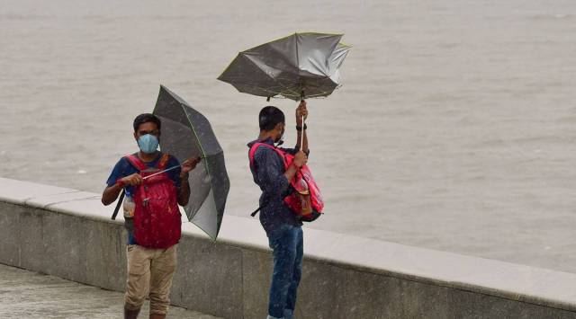 People at Marine Drive during rains in Mumbai. (PTI)