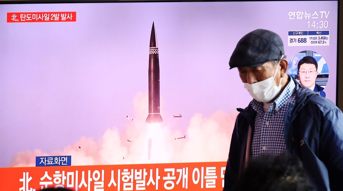 People watch a TV broadcasting file footage of a news report on North Korea firing what appeared to be a pair of ballistic missiles off its east coast, in Seoul, South Korea, September 15, 2021. (Reuters)