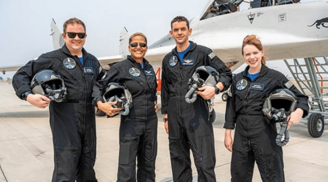 In this Aug. 8, 2021 photo provided by John Kraus, from left, Chris Sembroski, Sian Proctor, Jared Isaacman and Hayley Arceneaux stand for a photo in Bozeman, Mont., during a "fighter jet training" weekend to familiarize the crew with G-forces. (John Kraus/Inspiration4 via AP)
