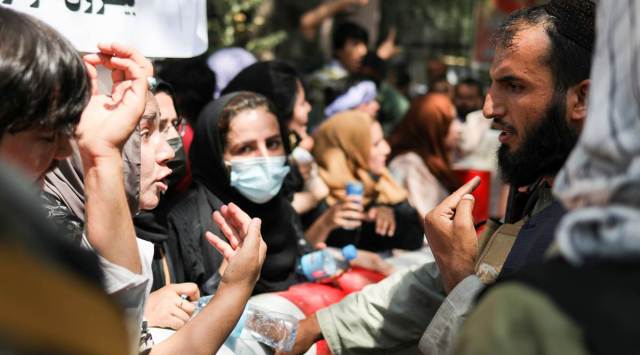 Protesters argue with a Taliban soldier during an anti-Pakistan demonstration in Kabul on Tuesday. (WANA via Reuters)