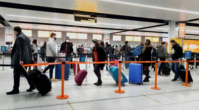 Testing for unvaccinated passengers from non-red countries will include pre-departure tests, day 2 and day 8 PCR tests. (Gareth Fuller/PA via AP)