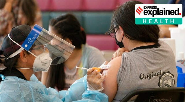 Beneficiaries get vaccinated with the Pfizer's COVID-19 vaccine at the Esteban E. Torres High School in Los Angeles. (AP Photo)