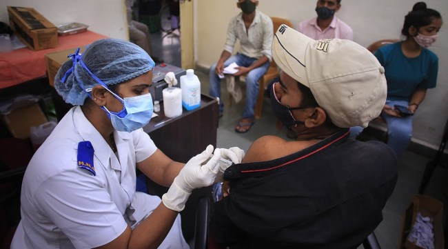A beneficiary getting vaccinated. (Express Photo by Amit Chakravarty)