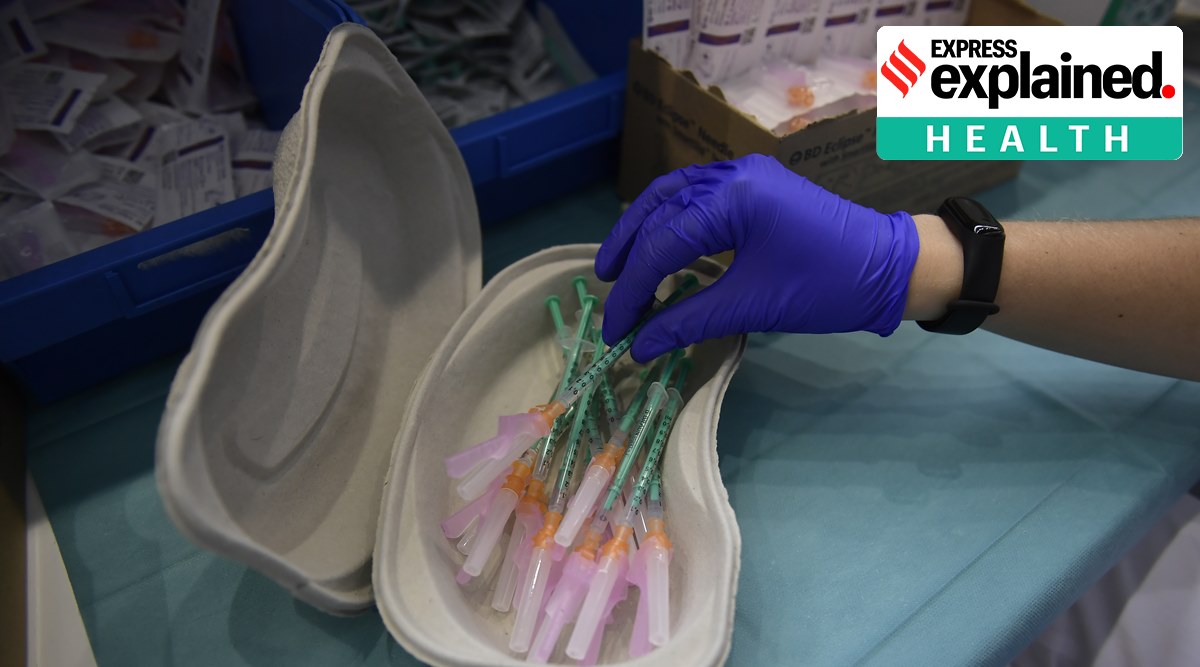 A healthworker prepares shots of a Covid-19 vaccine. (AP Photo/Alvaro Barrientos, File)