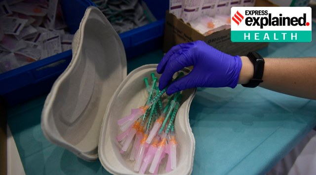 A healthworker prepares shots of a Covid-19 vaccine. (AP Photo/Alvaro Barrientos, File)