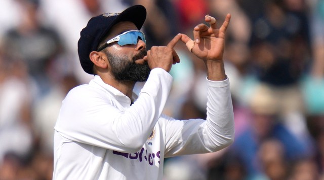 India's Virat Kohli pretends to play a trumpet during the fourth Test against England. (AP)