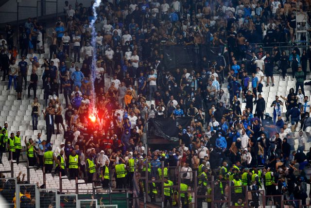 marseille galatasaray match halted after rivals fans clash