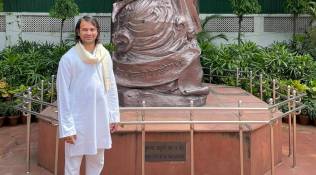 Minutes after Lalu’s return to Patna, Tej Pratap sits on a dharna