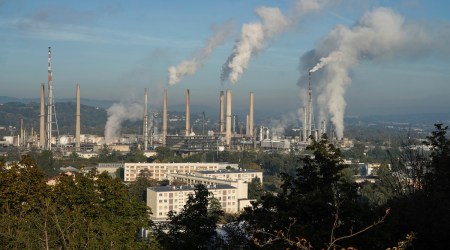 Smoke rises from the Feyzin Total refinery chimneys, outside Lyon, central France, Friday, Oct. 15, 2021. (AP)