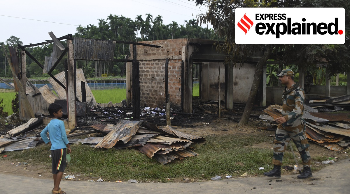 A paramilitary soldier patrols past a shop that was set on fire in Rowa village, about 220 kilometers from Agartala, in Tripura (AP)