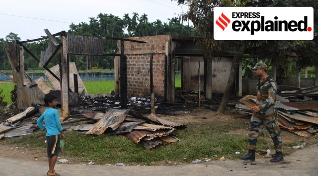 A paramilitary soldier patrols past a shop that was set on fire in Rowa village, about 220 kilometers from Agartala, in Tripura (AP)