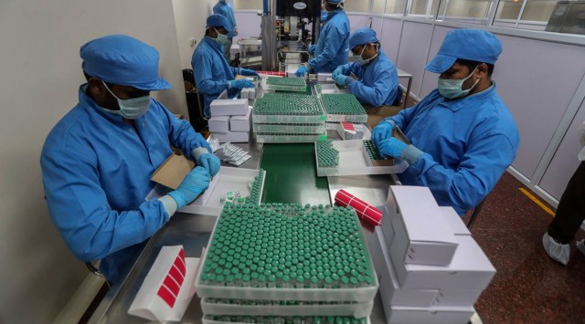 Employees pack boxes containing vials of Covishield, a version of the AstraZeneca vaccine at the Serum Institute of India in Pune, India. (AP/File Photo)