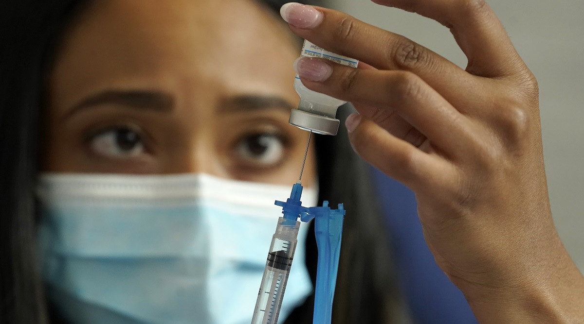 File photo of a nurse drawing a Moderna COVID-19 vaccine into a syringe at a mass vaccination clinic in Massachusetts. (AP) 